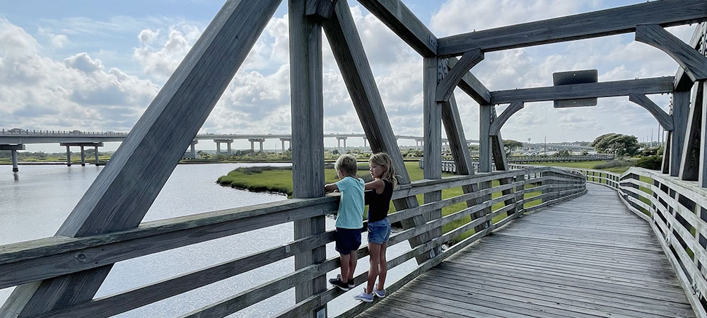 Soundside Park in Surf City, NC features an abundance of boardwalks giving up close access to the Intracoastal Waterway and easy visibility into local marine life including small fish, birds and crabs.