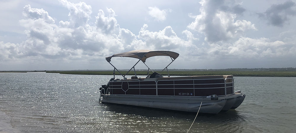 Surf City Boat Rentals in Surf City, NC rented the Topsail Guide Editors this pontoon boat in the Summer of 2021. Easy to maneuver and anchor up on sandbars, pontoon boat rentals offers secluded access to some of the most pristine locations in the Topsail area. 