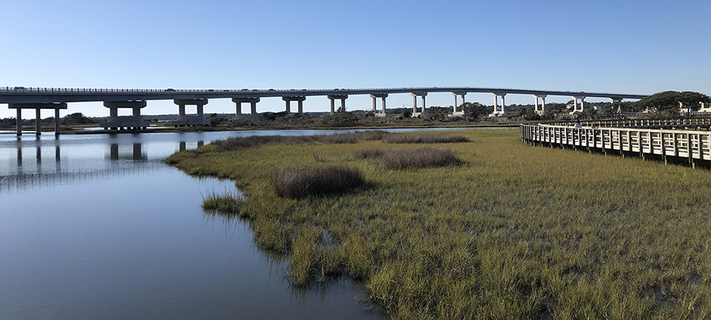 View of Surf City Bridge in Surf City, NC as photographed from the boardwalks of Soundside Park.