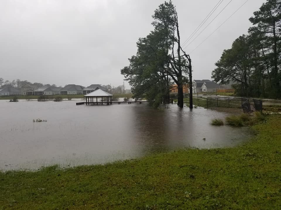 Floodwater covering the pond and gazebo deck behind Wyndwater in Hampstead, September 2018